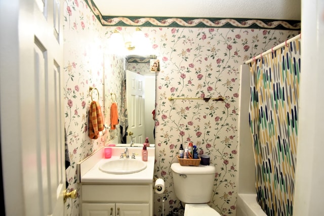 2023 Brackin Dr, Dothan, AL 36301 - bathroom with vanity, wallpapered walls, toilet, and shower / bathtub combination with curtain
