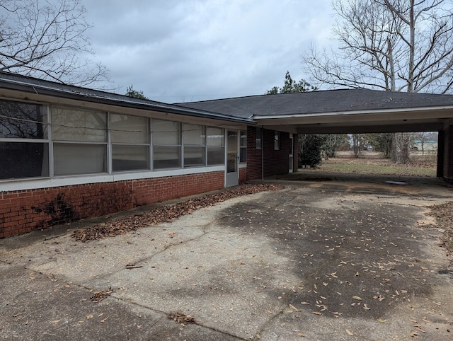 view of side of property featuring a carport