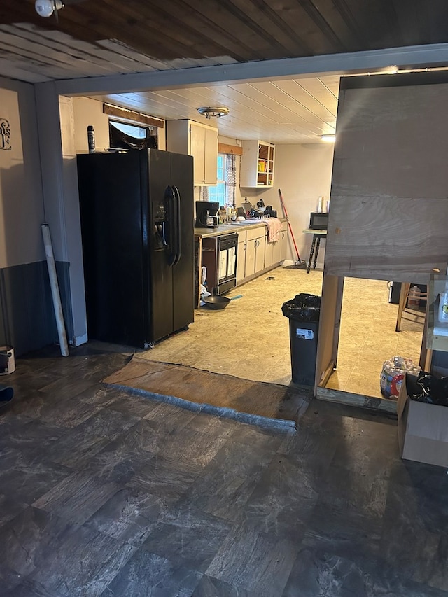 kitchen with black appliances and wooden ceiling