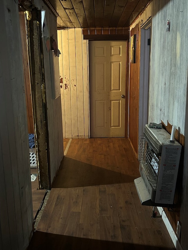 corridor featuring hardwood / wood-style flooring, wooden ceiling, and wooden walls