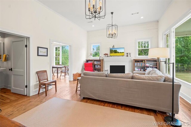 5606 Rocky Creek Rd, Ashford, AL 36312 - living room featuring a chandelier, wood finished floors, a fireplace, and recessed lighting