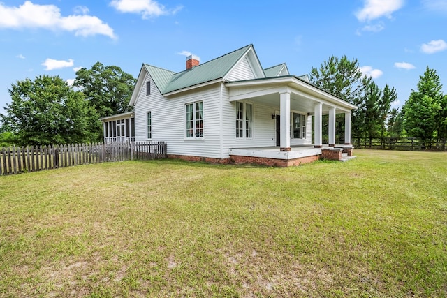 5606 Rocky Creek Rd, Ashford, AL 36312 - view of property exterior featuring a metal roof and a chimney