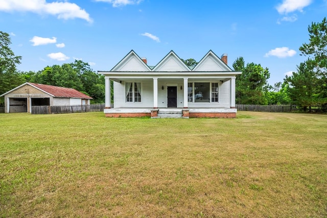 5606 Rocky Creek Rd, Ashford, AL 36312 - view of front of house featuring a detached garage, a chimney, and covered porch