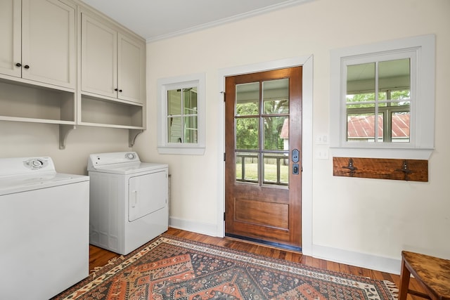 5606 Rocky Creek Rd, Ashford, AL 36312 - washroom with cabinet space, washer and clothes dryer, wood finished floors, and ornamental molding