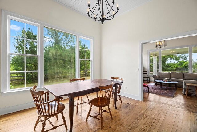 5606 Rocky Creek Rd, Ashford, AL 36312 - dining space with a chandelier, light wood-style flooring, plenty of natural light, and ornamental molding