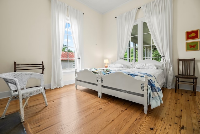 5606 Rocky Creek Rd, Ashford, AL 36312 - bedroom with light wood-type flooring and baseboards