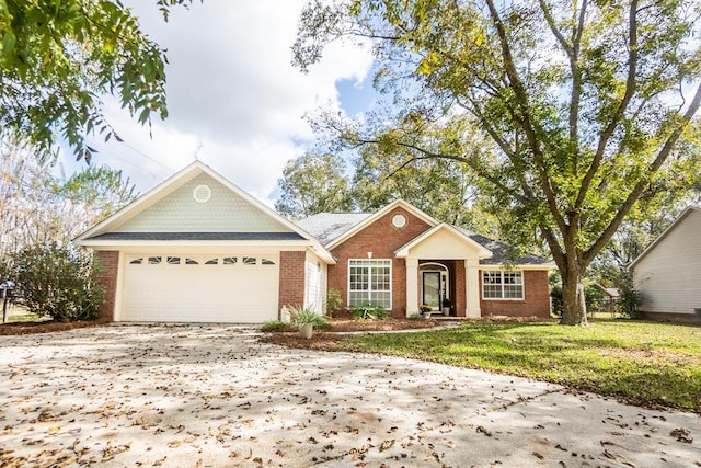 single story home with a front yard and a garage