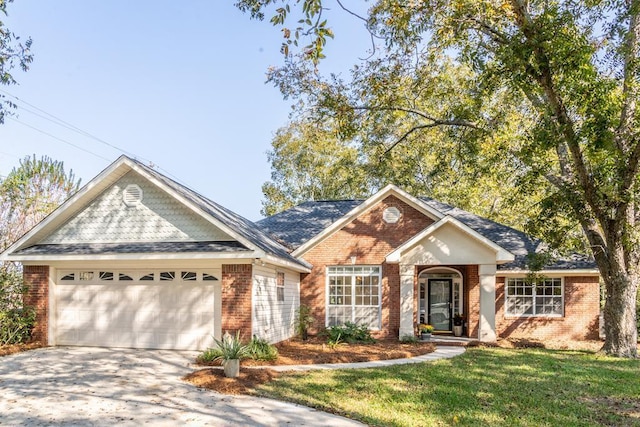 view of front facade featuring a garage, driveway, brick siding, and a front lawn