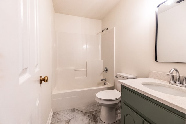 full bathroom featuring washtub / shower combination, marble finish floor, vanity, and toilet