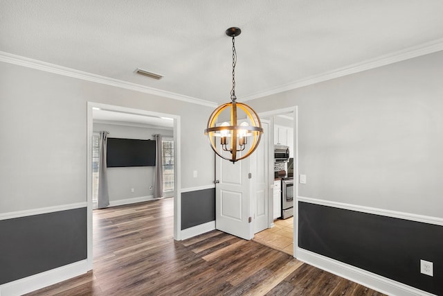 unfurnished dining area featuring visible vents, wood finished floors, and crown molding