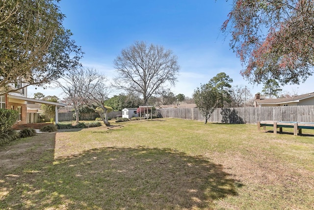 view of yard with a fenced backyard