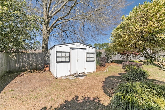 view of shed with a fenced backyard