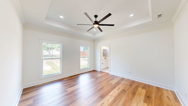 108 Weeping Willow Trl, Headland, AL 36345 - spare room with a tray ceiling, ornamental molding, light wood-type flooring, a ceiling fan, and recessed lighting