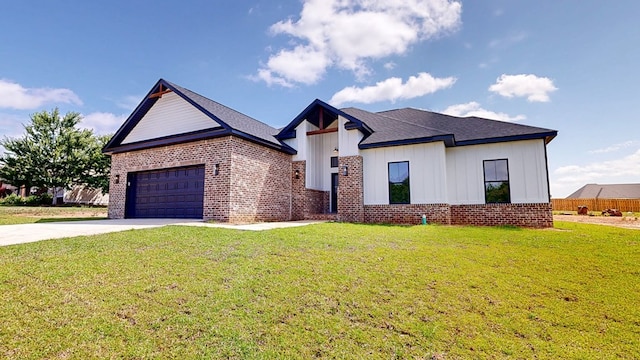 108 Weeping Willow Trl, Headland, AL 36345 - view of front of property featuring brick siding, concrete driveway, a garage, and a front yard