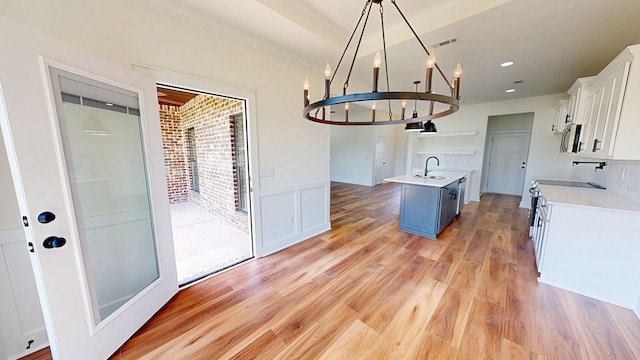 108 Weeping Willow Trl, Headland, AL 36345 - kitchen featuring appliances with stainless steel finishes, ornamental molding, a sink, light countertops, and white cabinets