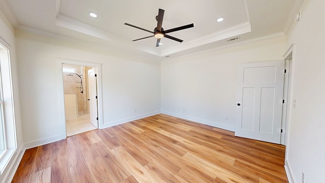 108 Weeping Willow Trl, Headland, AL 36345 - unfurnished room featuring a raised ceiling, crown molding, ceiling fan, light wood-style flooring, and recessed lighting