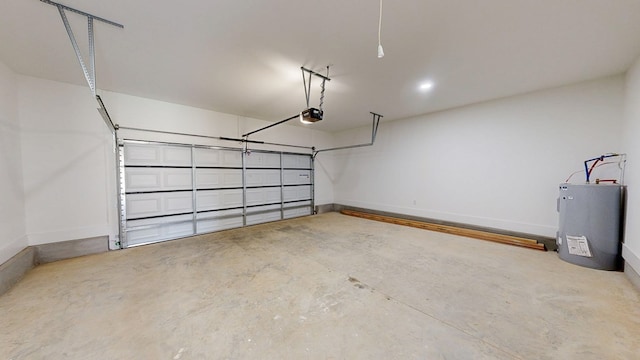 108 Weeping Willow Trl, Headland, AL 36345 - garage featuring electric water heater, a garage door opener, and baseboards