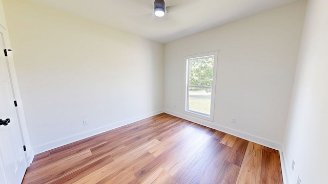 108 Weeping Willow Trl, Headland, AL 36345 - spare room with a ceiling fan, light wood-type flooring, and baseboards