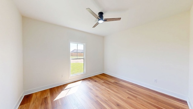 108 Weeping Willow Trl, Headland, AL 36345 - unfurnished room featuring light wood finished floors, ceiling fan, and baseboards