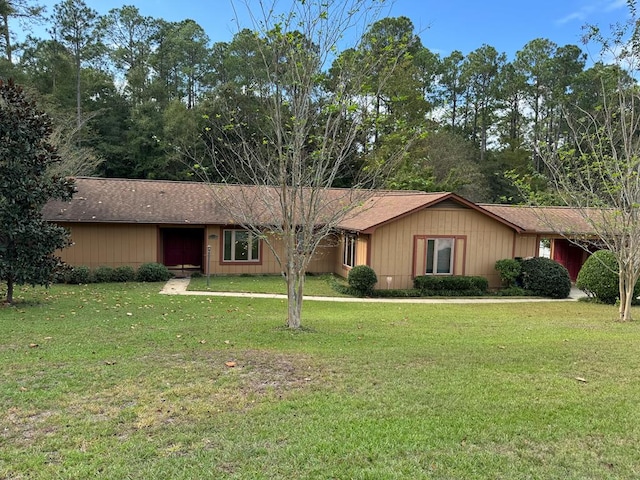 ranch-style home featuring a front yard