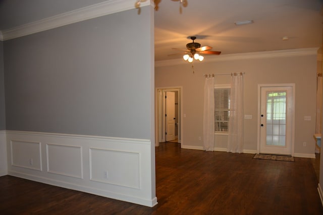 unfurnished room with ceiling fan, baseboards, ornamental molding, and wood finished floors