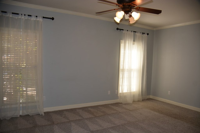 empty room featuring carpet flooring, a ceiling fan, baseboards, and ornamental molding
