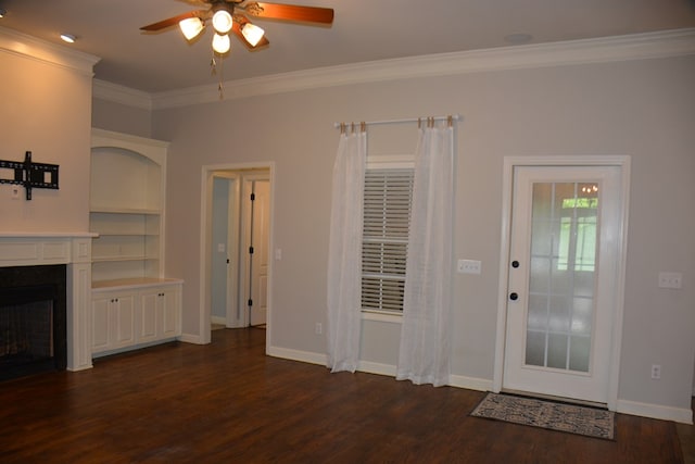 unfurnished living room with a ceiling fan, crown molding, a fireplace, baseboards, and dark wood-type flooring