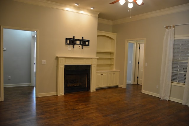 unfurnished living room with a fireplace, crown molding, dark wood-type flooring, and ceiling fan