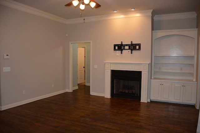 unfurnished living room with a ceiling fan, crown molding, a fireplace, dark wood finished floors, and baseboards