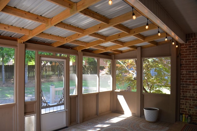 unfurnished sunroom with plenty of natural light