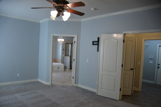 unfurnished bedroom with baseboards, ornamental molding, and carpet floors