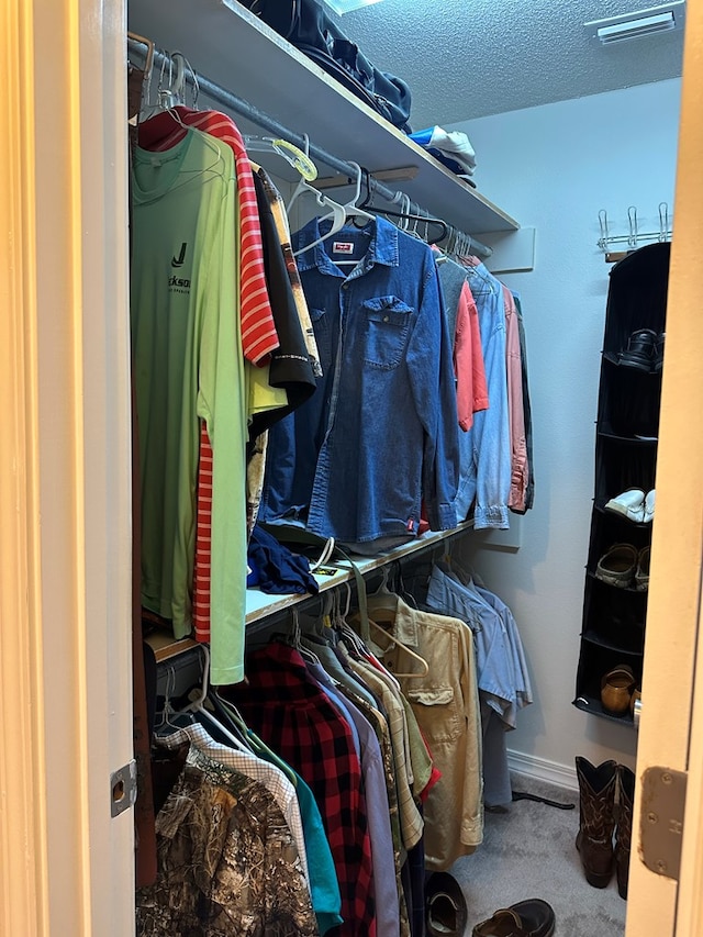 walk in closet with carpet flooring and visible vents