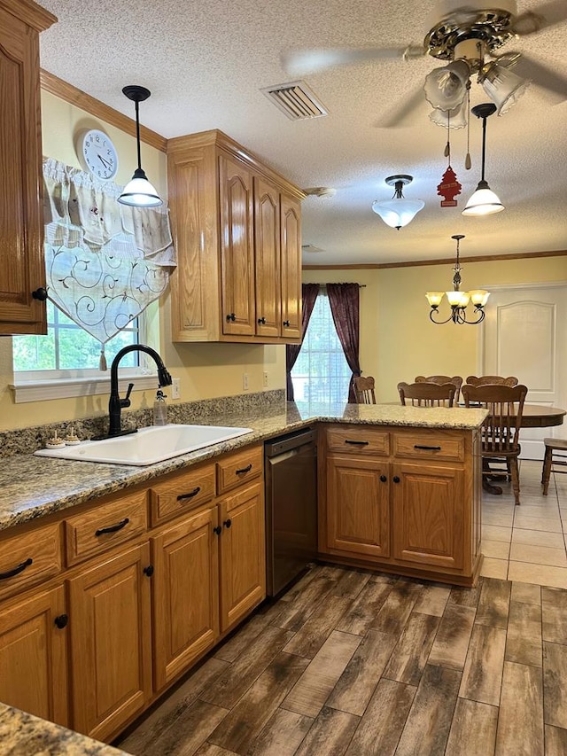 kitchen with visible vents, stainless steel dishwasher, a sink, a peninsula, and ornamental molding