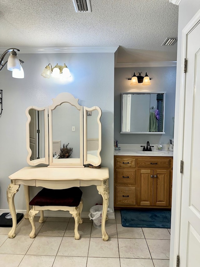 bathroom with crown molding, a textured ceiling, visible vents, and vanity