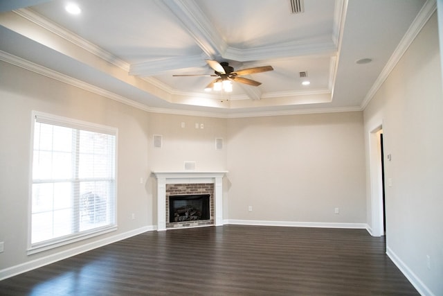 unfurnished living room with ceiling fan, ornamental molding, a fireplace, and dark hardwood / wood-style flooring