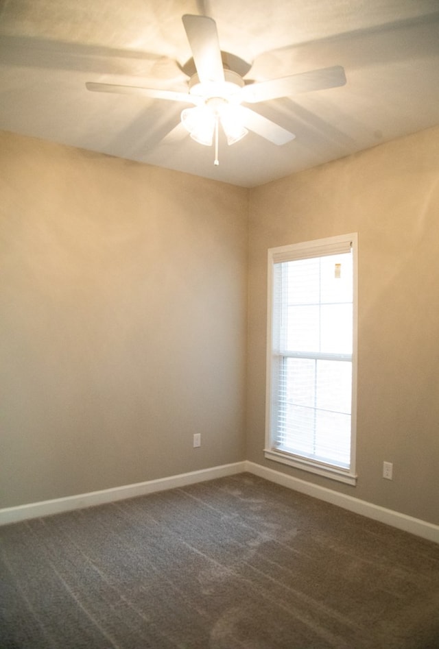 carpeted empty room with ceiling fan