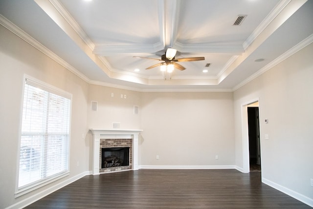 unfurnished living room featuring a brick fireplace, crown molding, dark hardwood / wood-style floors, and ceiling fan