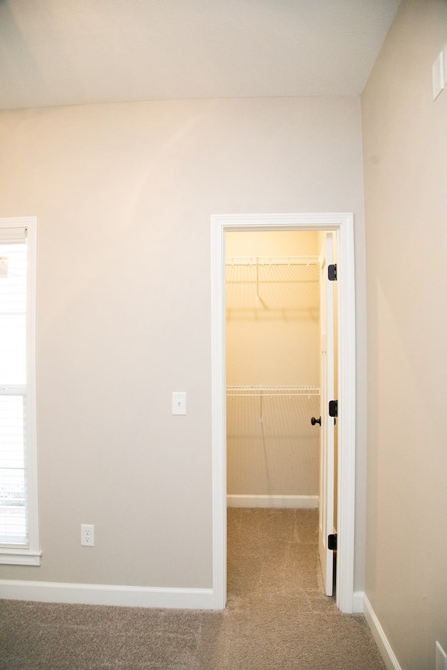 corridor with light carpet