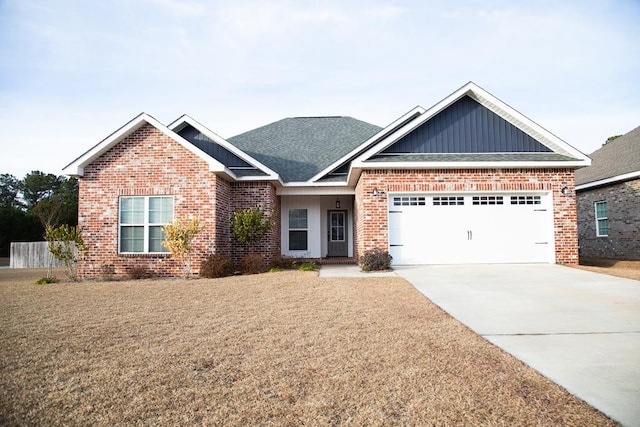 craftsman-style house featuring a garage and a front lawn