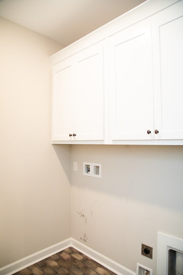 clothes washing area featuring washer hookup, cabinets, and hookup for an electric dryer