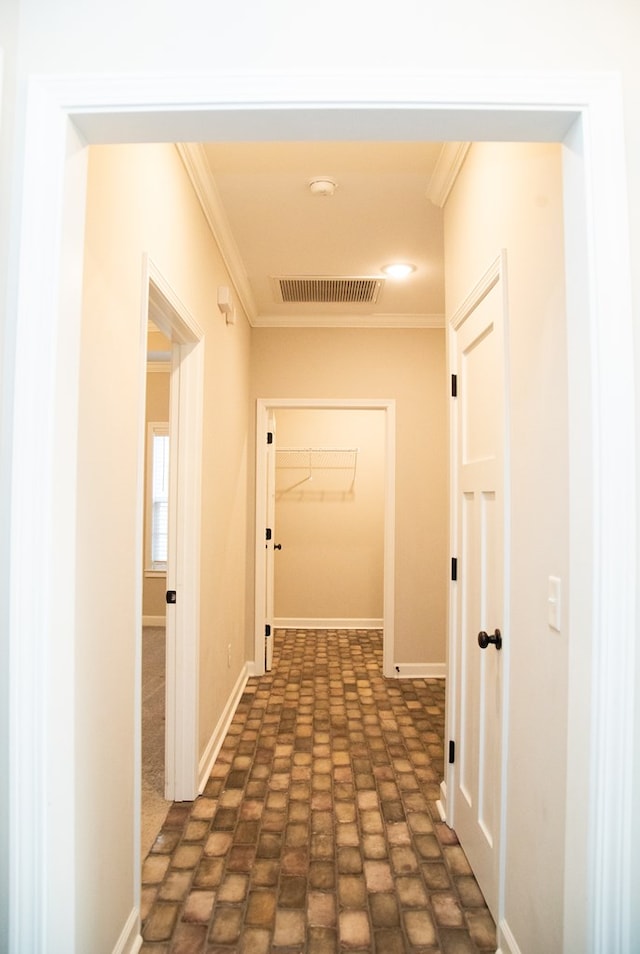 corridor featuring crown molding