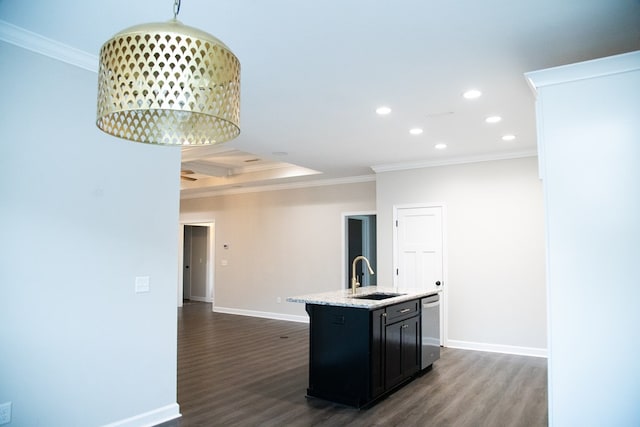 kitchen featuring stainless steel dishwasher, ornamental molding, sink, and a center island with sink