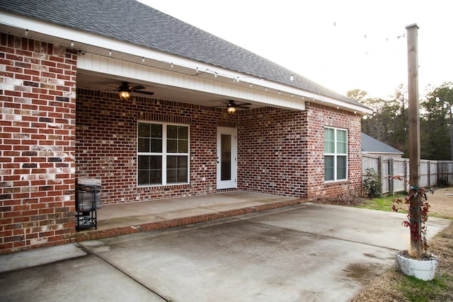 exterior space with ceiling fan and a patio