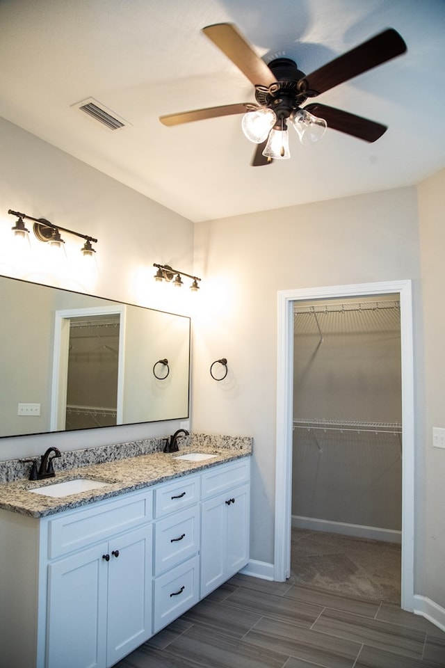 bathroom with vanity and ceiling fan