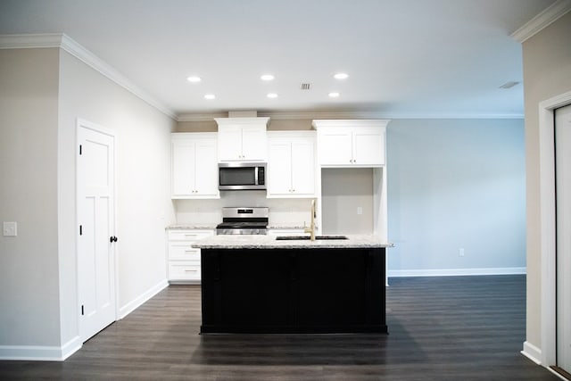 kitchen featuring crown molding, dark wood-type flooring, a kitchen island with sink, stainless steel appliances, and white cabinets