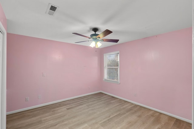 empty room featuring ceiling fan and light hardwood / wood-style floors