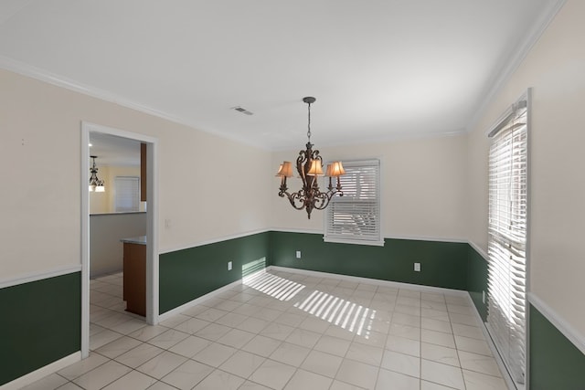 unfurnished room with ornamental molding, light tile patterned floors, and a chandelier