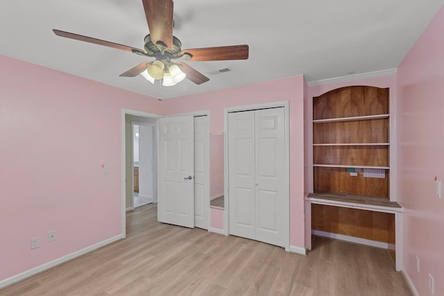 unfurnished bedroom featuring light hardwood / wood-style floors and ceiling fan