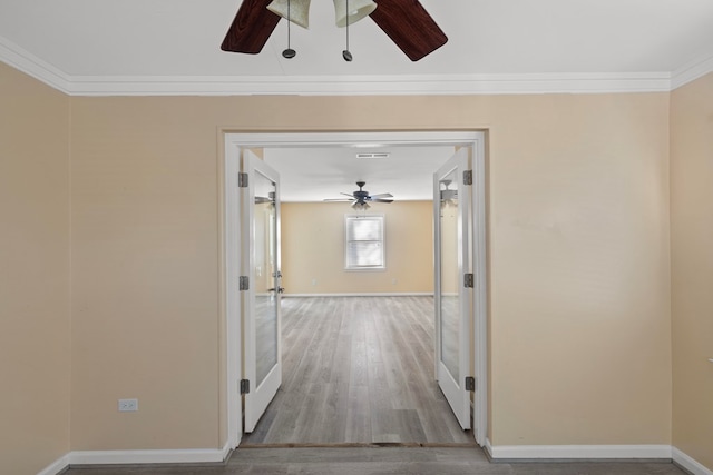 hall featuring hardwood / wood-style floors and ornamental molding