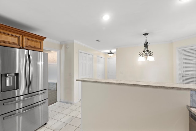 kitchen with light stone counters, ornamental molding, pendant lighting, stainless steel fridge with ice dispenser, and light tile patterned flooring